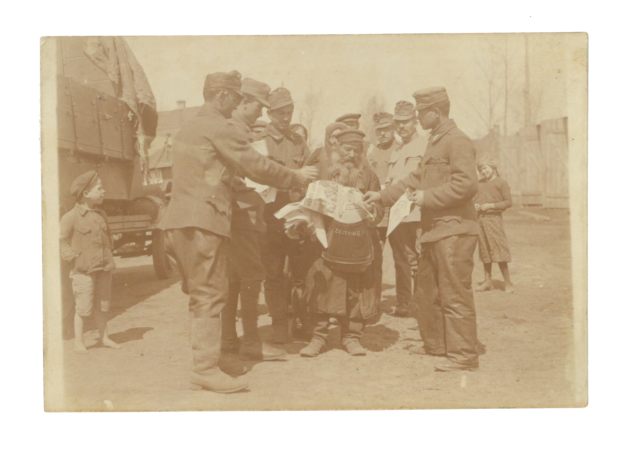 Soldiers buying news sheets