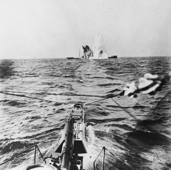 A surfaced U-Boat torpedoes a merchant steamer during the First World War. © IWM (Q 20343)
