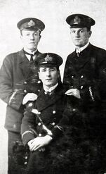 Mendel in uniform with brother Joe and friend Joe Feldman (seated)