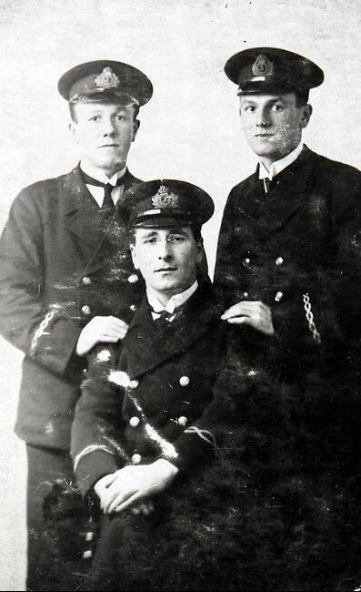 Mendel in uniform with brother Joe and friend Joe Feldman (seated)