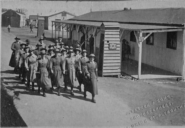 Women marching past a Magen David