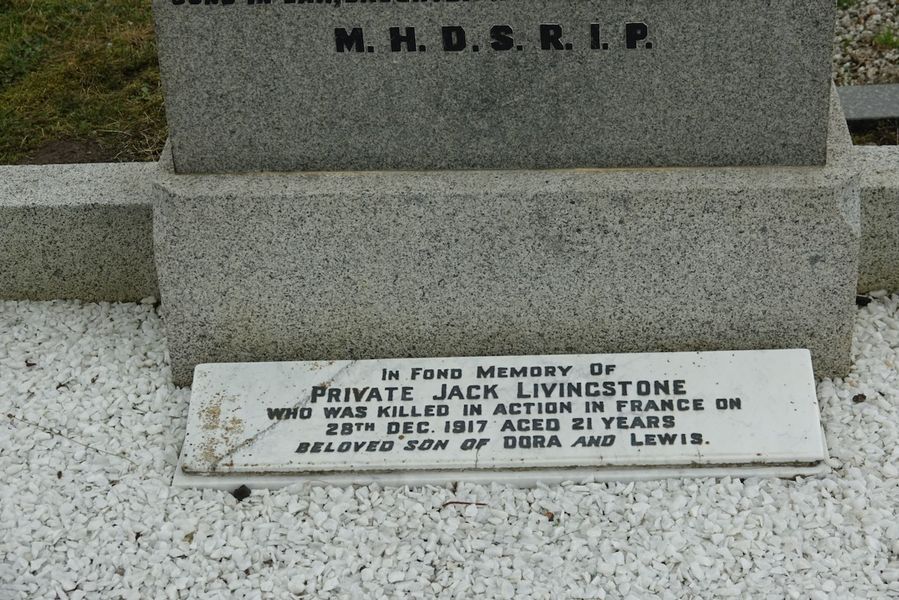 Memorial on family headstone