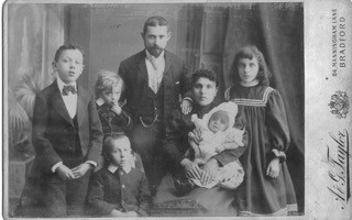 Harry and family - Harry is sucking his thumb