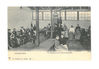 Refugees in a Hall at Hamburg awaiting embarkation, central heating stove.