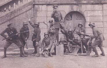 With his battalion (Alex is in the middle, standing on the block).