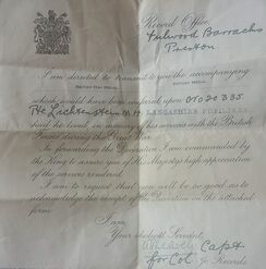 Certificate accompanying medals