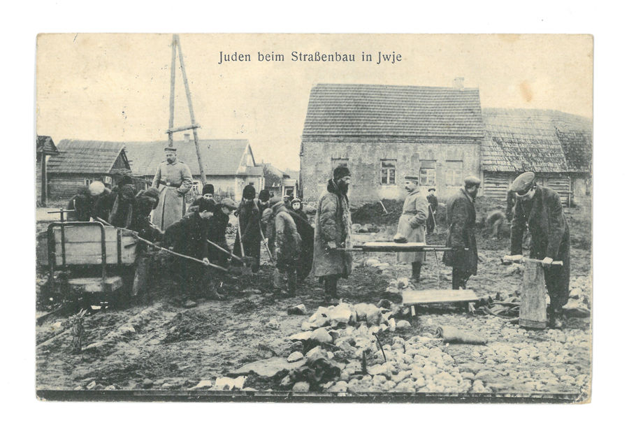Officers supervising Jews building a road