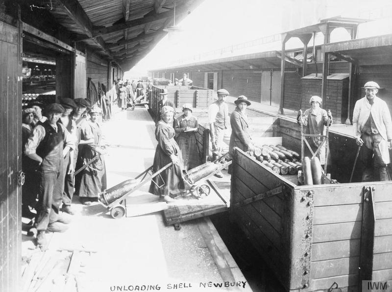 Female munition workers unloading shells from a railway wagon at Newbury Station. © IWM (Q 110251)