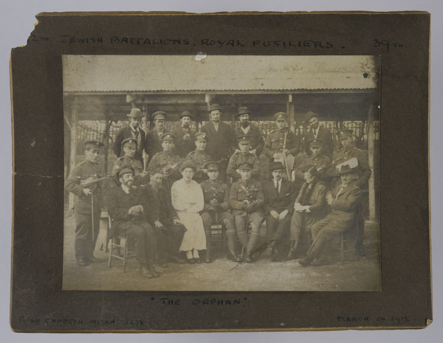 Mounted photograph of a theatre group in a play entatiled "The Orhan". ©Jewish Museum London/Jewish Military Museum