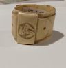 Bone napkin holder in belt design made in internment camp on Isle of Man (Manchester Jewish Museum)