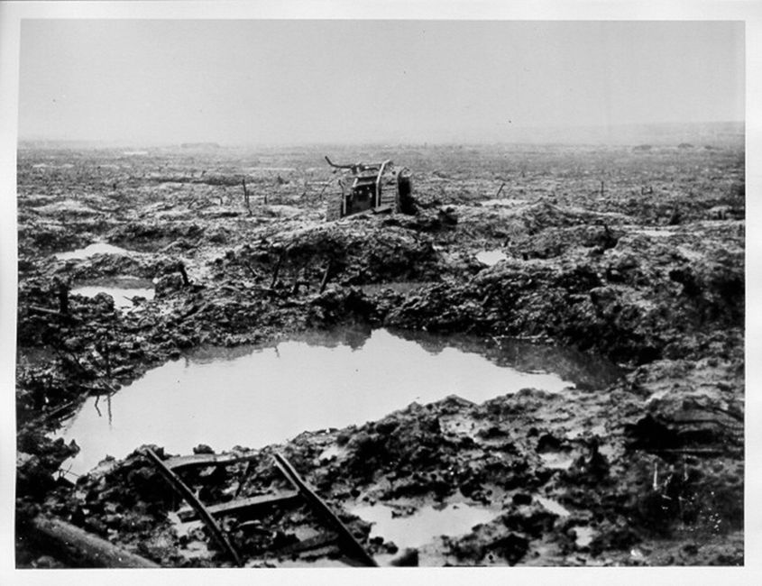 Assault on Passchendaele 12 October - 6 November: A derelict tank stuck in the mud. © IWM (CO 2241)