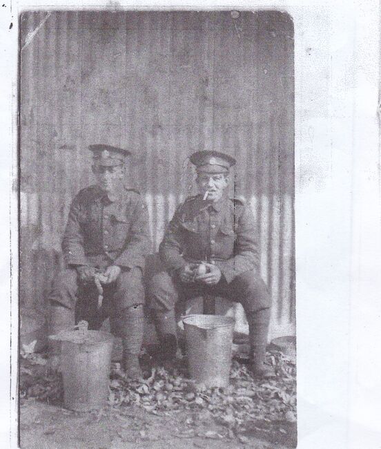 Peeling potatoes in full uniform with cousin Louis Garstin