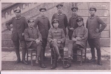 With his battalion (Alex is sitting in the middle)