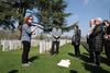 Lijssenthoeck CWGC with Paula Kitching talking to group. We Were There Too trip to Ypres, April 2017. By Alan Brill, Voluntary Photographer