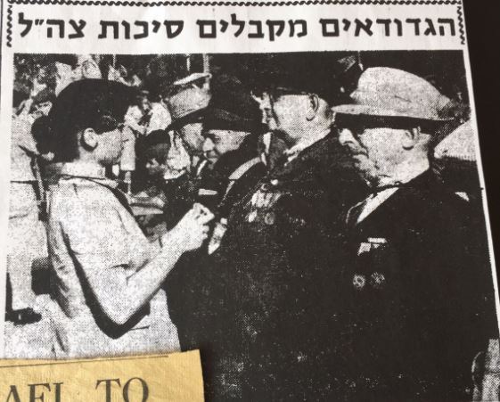Receiving a medal (at the front)