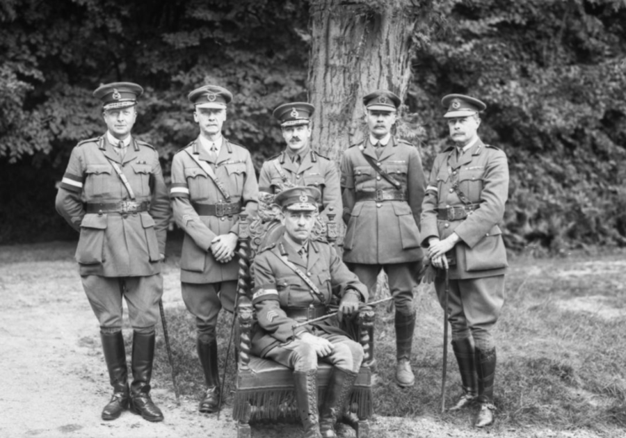 John (sitting) with officers
